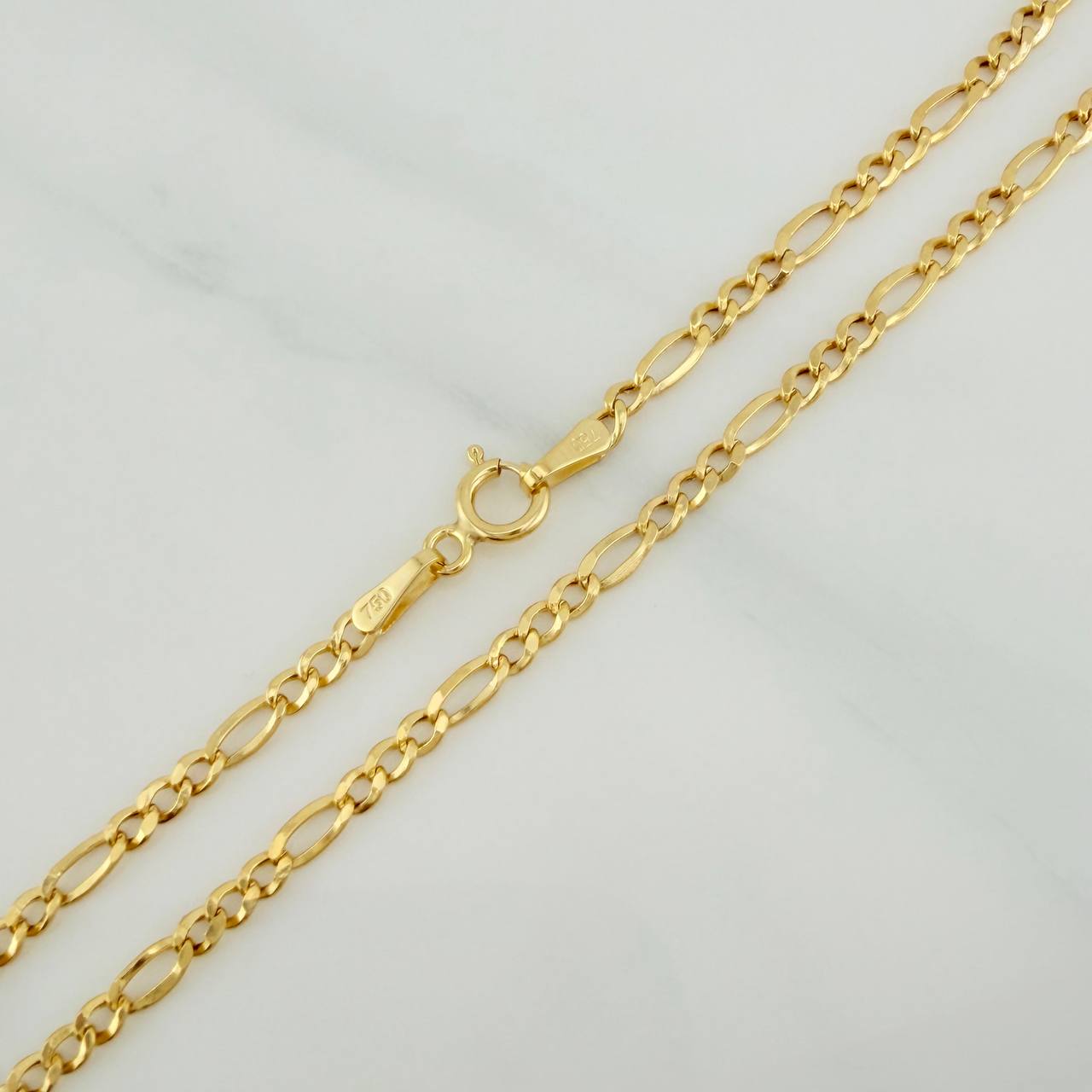 Cadena Figaro 3.05gr / 60.2cm / 2.38mm Oro Amarillo +1 18K $