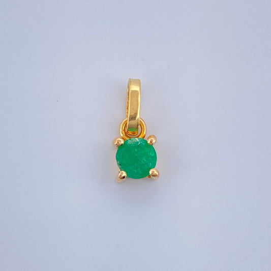 Dije Circular Esmeralda 0.5gr / 1.1cm / Oro Amarillo 18K %
