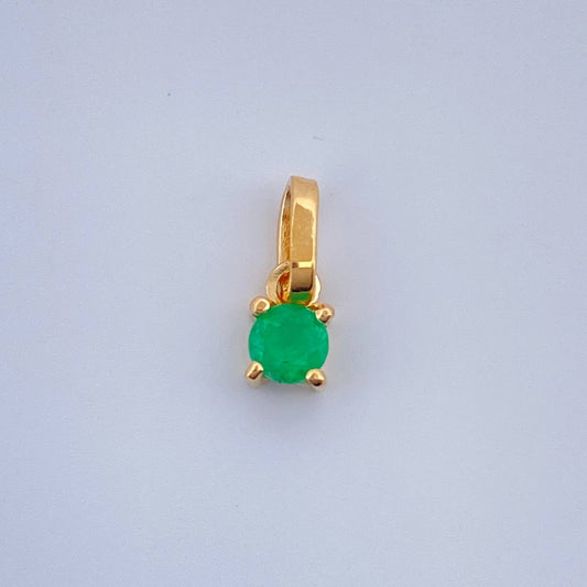 Dije Circular Esmeralda 0.45gr / 1cm / Oro Amarillo 18K %