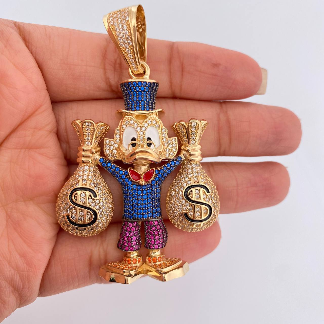 Dije Pato Bolsas de Dinero 34.9gr / 6.7cm / Oro Amarillo 18K $