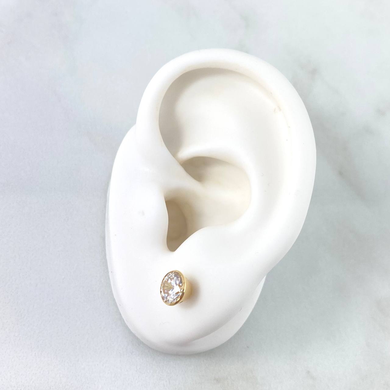 Topos Bisel 1.15gr / 6mm Circon Blanco Oro Amarillo 18K *