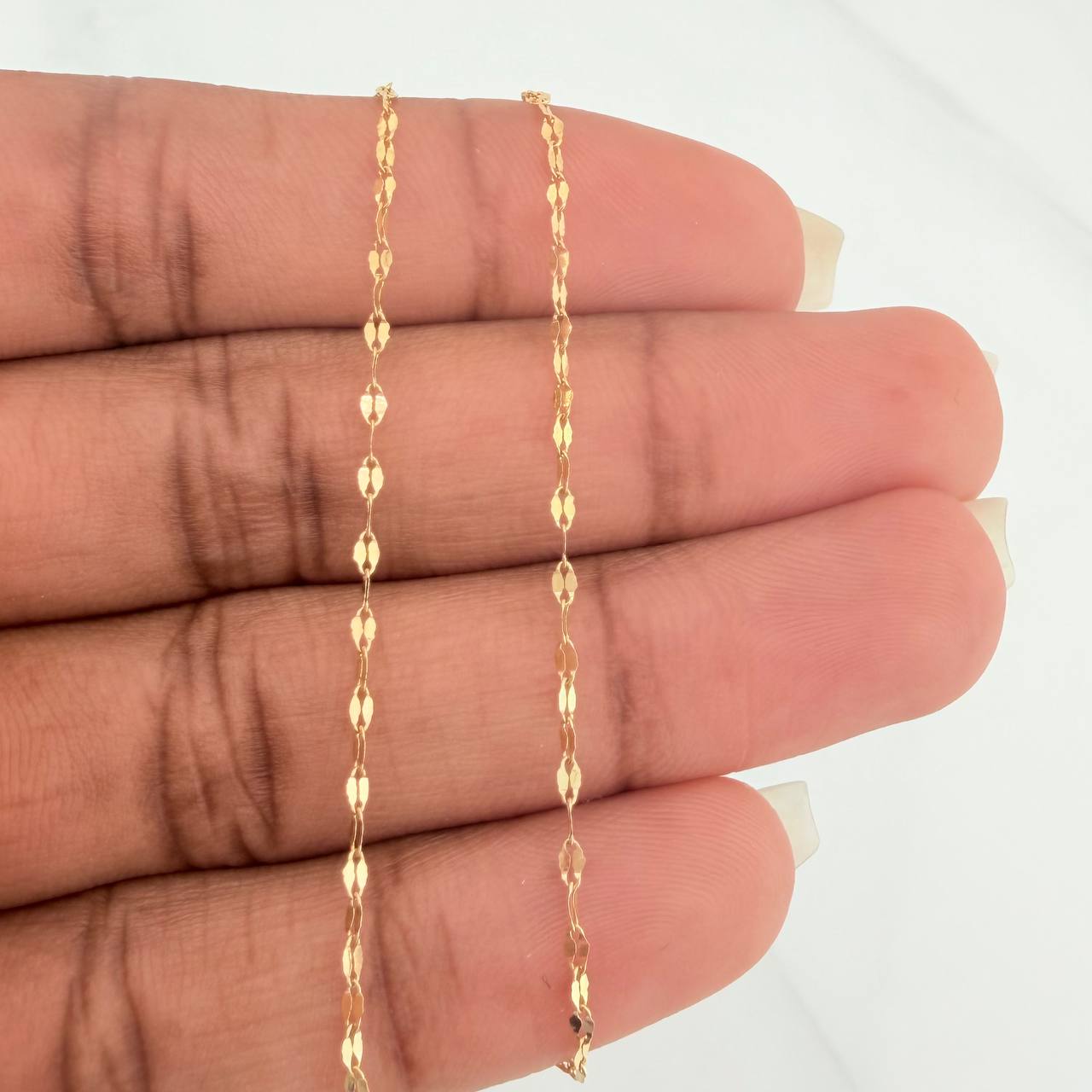 Cadena Flor Espejo 1.15gr / 60.3cm / 0.9mm Oro Amarillo +3 18K %