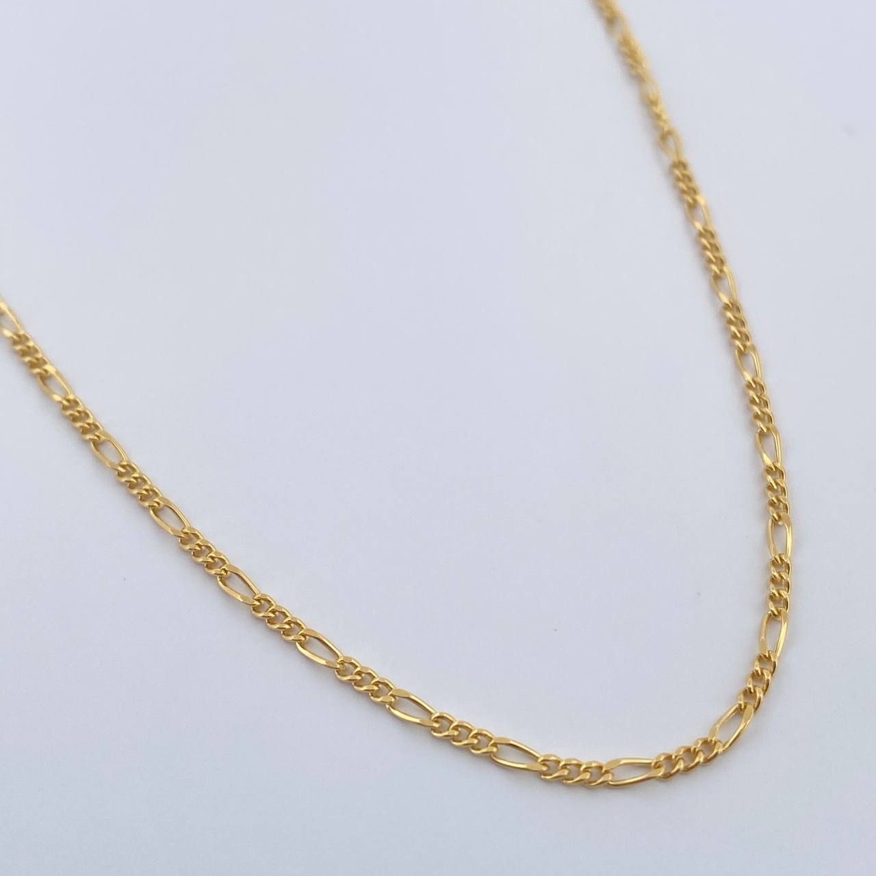 Cadena Figaro 1.5gr / 50.5cm / 1.4mm Oro Amarillo +1 18K $