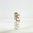 Dije FE 2.55gr / 2.6cm / Circones Blancos Oro Amarillo ©