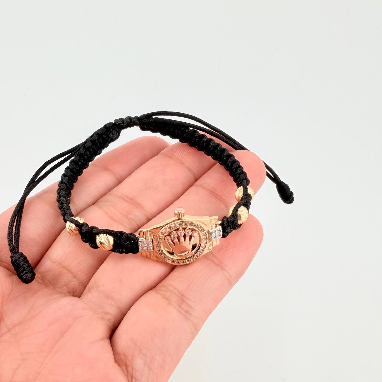 Pulsera Tejida Negra Correa Corona Bolas Diamantadas Oro Amarillo 18K