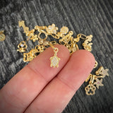 Dije Tortuga 0.4gr/1.6cm Tiny Circones Blancos Oro Amarillo*