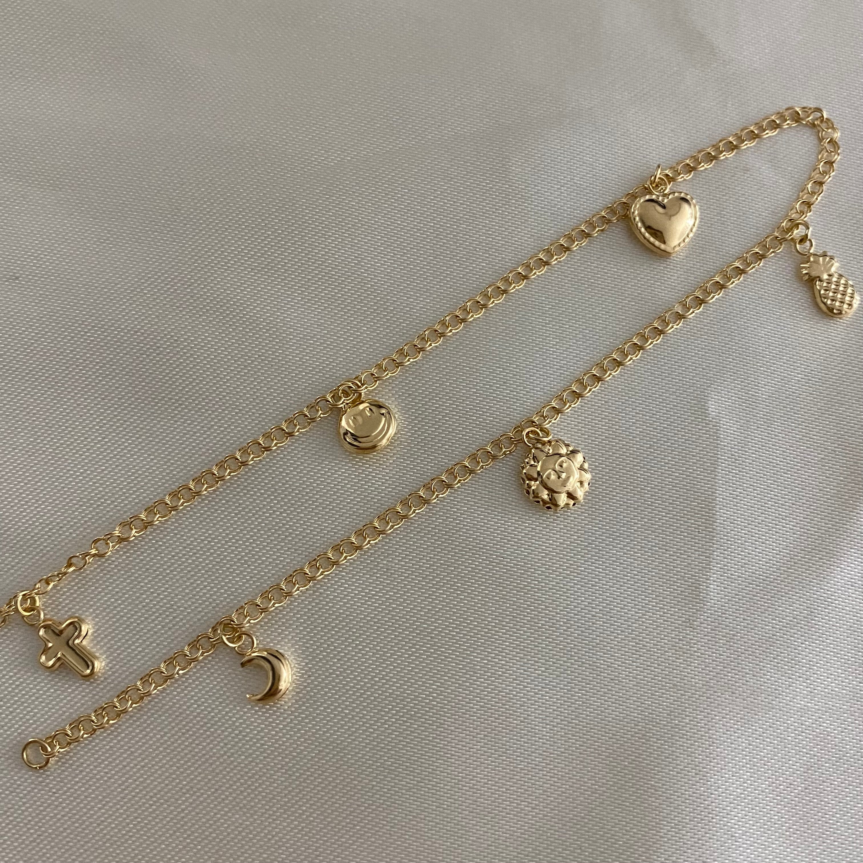 Tobillera Aro Seguido 3.35gr/26cm "LUNA-SOL-CORAZON-CARITA-CRUZ" Oro Amarillo