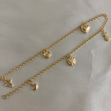 Tobillera Aro Seguido 3.35gr/26cm "LUNA-SOL-CORAZON-CARITA-CRUZ" Oro Amarillo