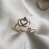 Anillo Corona 1.35gr - T7 1/2 Abrazo Oro Amarillo Circones Rosa Blancos