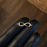 Herraje Infinito 0.95gr / 2.3cm Circones Blancos Oro Amarillo