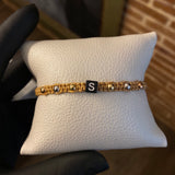 Pulsera Caqui Letra S Seis Pasos Bolas 4mm Lisas Tres Oros*