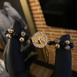 Pulsera Negra Cabeza Caballo Sabia Oscura Circones Blancos Dos Oros Amarillo Blancos*
