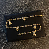 Tobillera GC 3.85gr / 24cm / 3.5mm "Delfín-Tortuga-Corazón-Sol-Oso" Oro Amarillo
