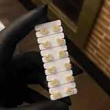 Topos Corazón 0.95gr Silueta Circones Blancos Oro Amarillo