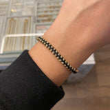 Pulsera Negra Correa Zig-zag Bolas 3mm Diamantadas Oro Amarillo*