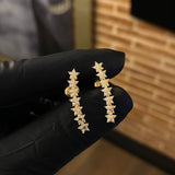 Topos Estela de Estrellas 1.9gr Circones Blancos Oro Amarillo