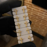 Topos Cruz 0.65gr Circon Blanco Oro Amarillo